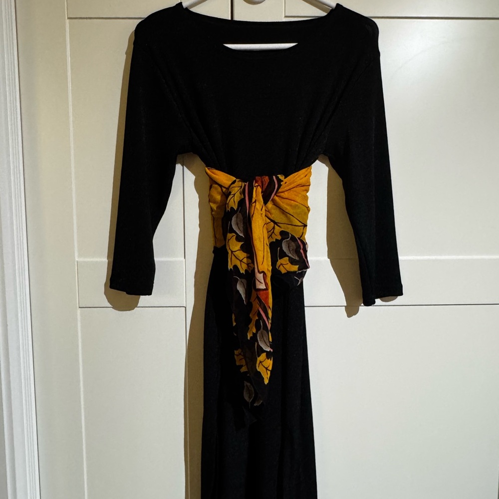 Elegant Black Dress with Floral Accent
